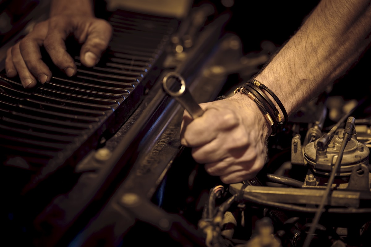 grayscale photo of person playing piano