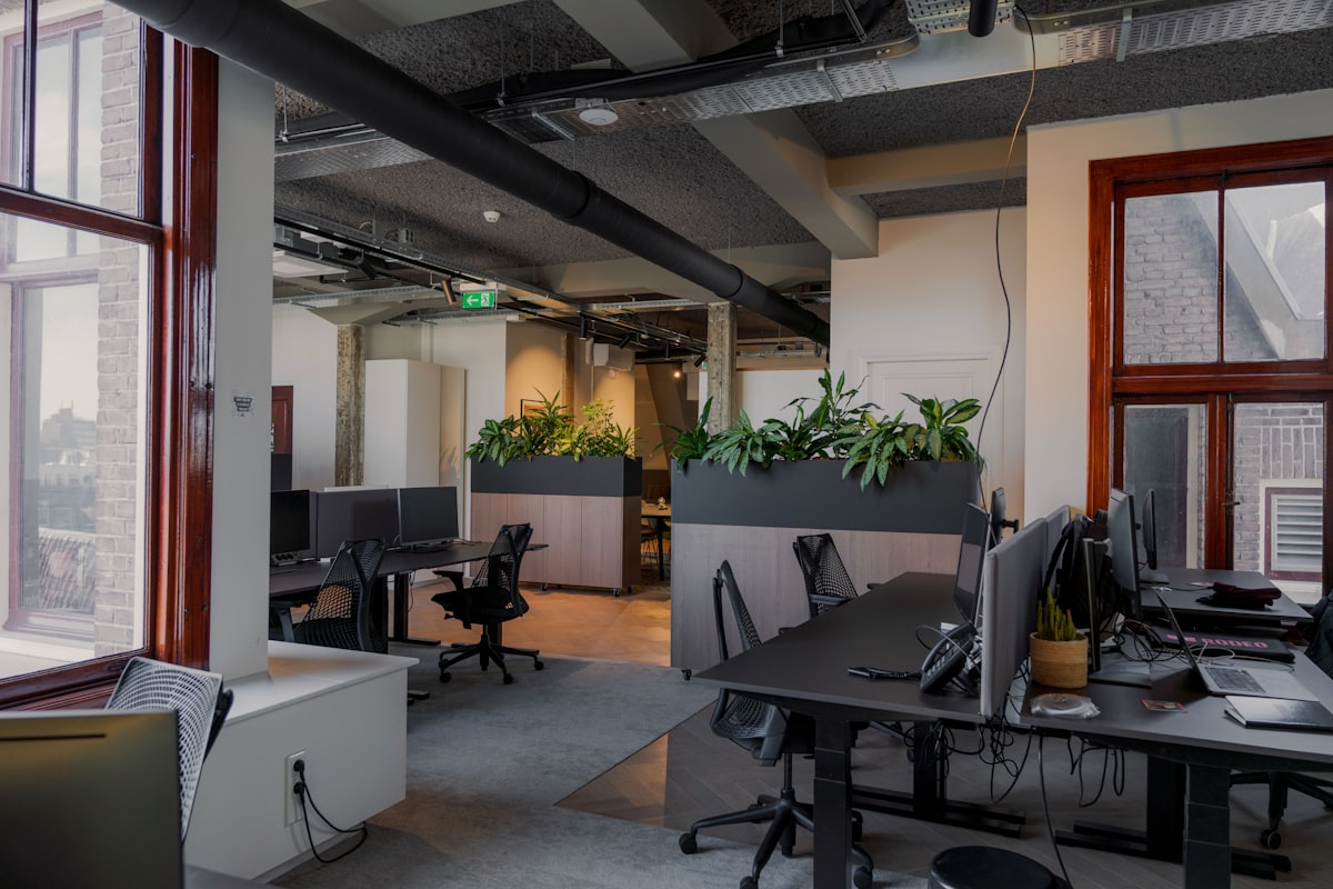 an office with a lot of desks and computers